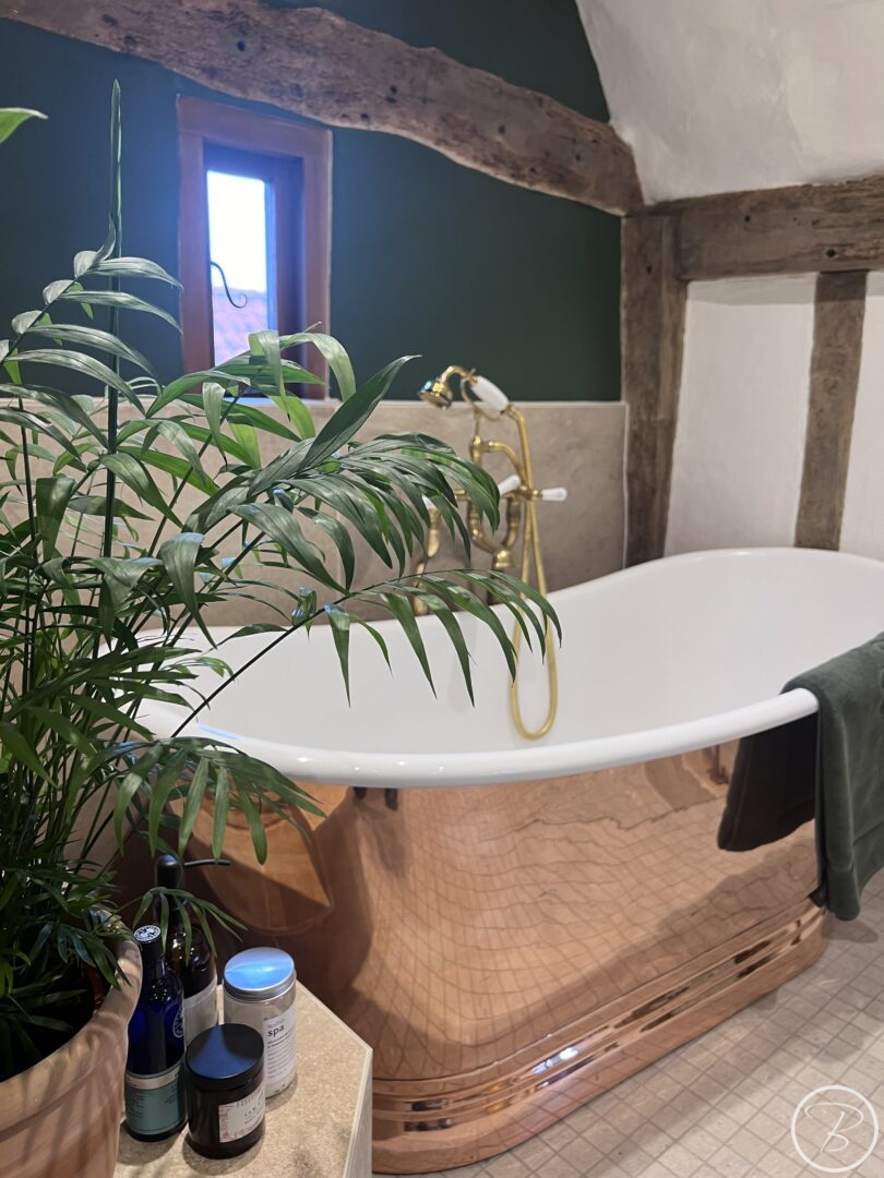Copper Bath and Beamed Walls