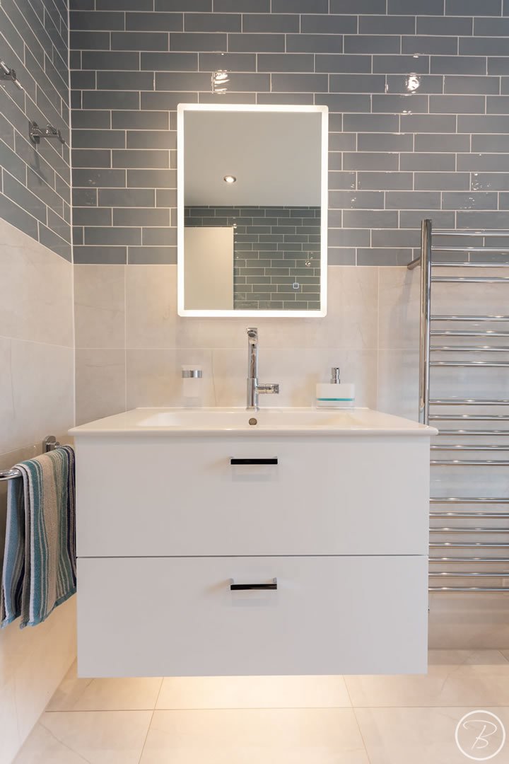 Illuminated mirror above sink unit for Bathroom in Ely designed and installed by Baytree Bathrooms