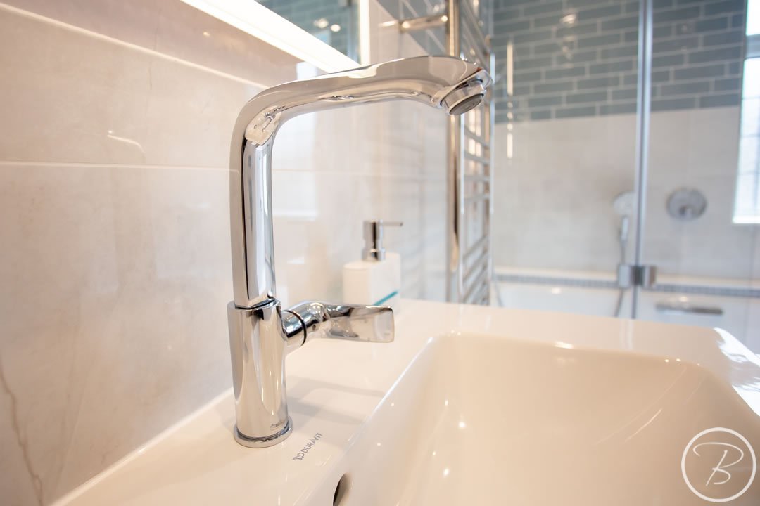 Bathroom in Ely designed and installed by Baytree Bathrooms chrome sink fittings