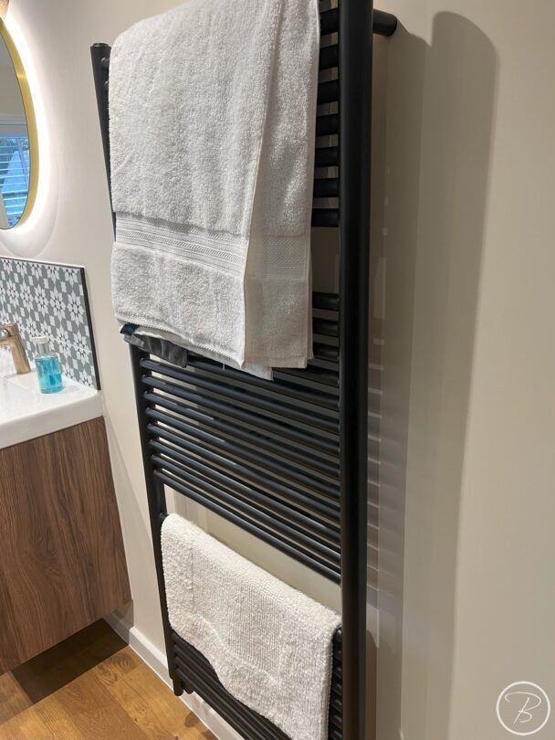 black towel rail with towels