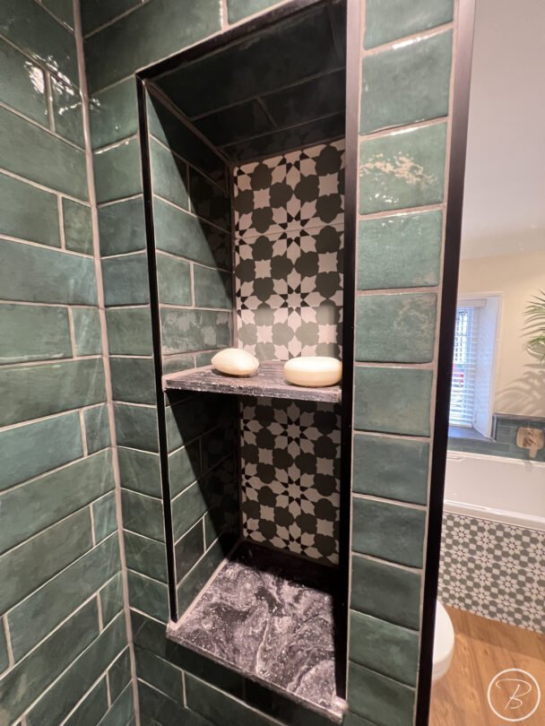 close up on shower niches with patterned tiles