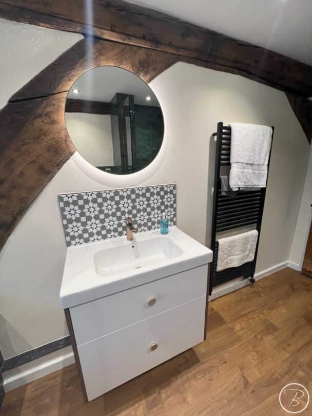 full view of the vanity unit and illuminated mirror