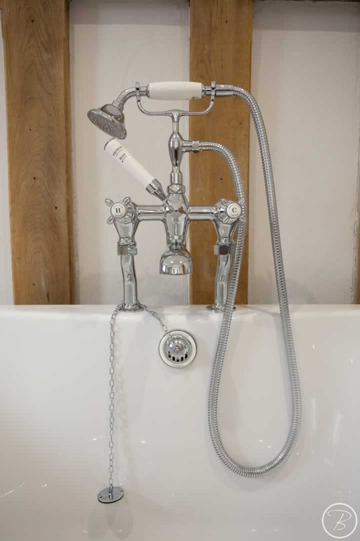 Bath taps and shower combination at Bathroom in Great Ashfield by Baytree Bathrooms