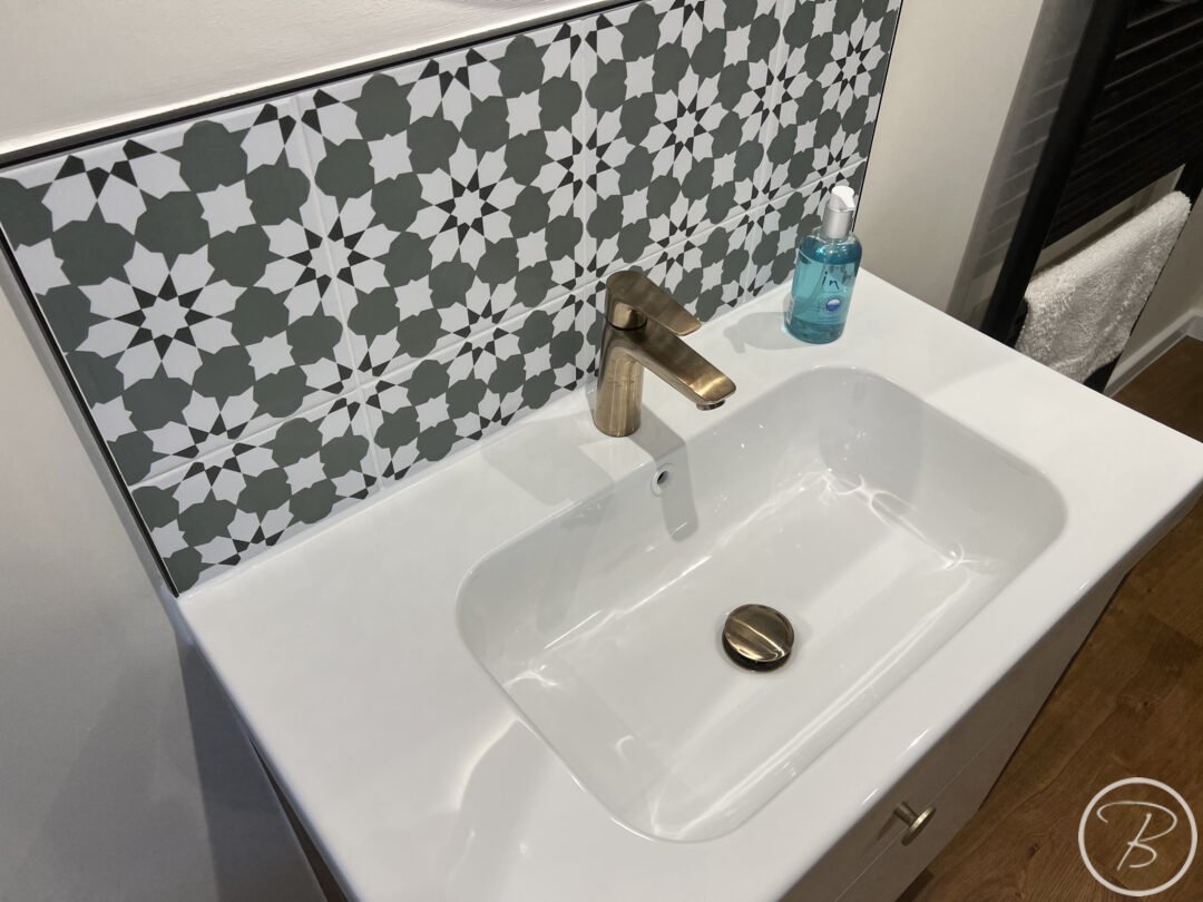 tiles sink and brushed bronze taps
